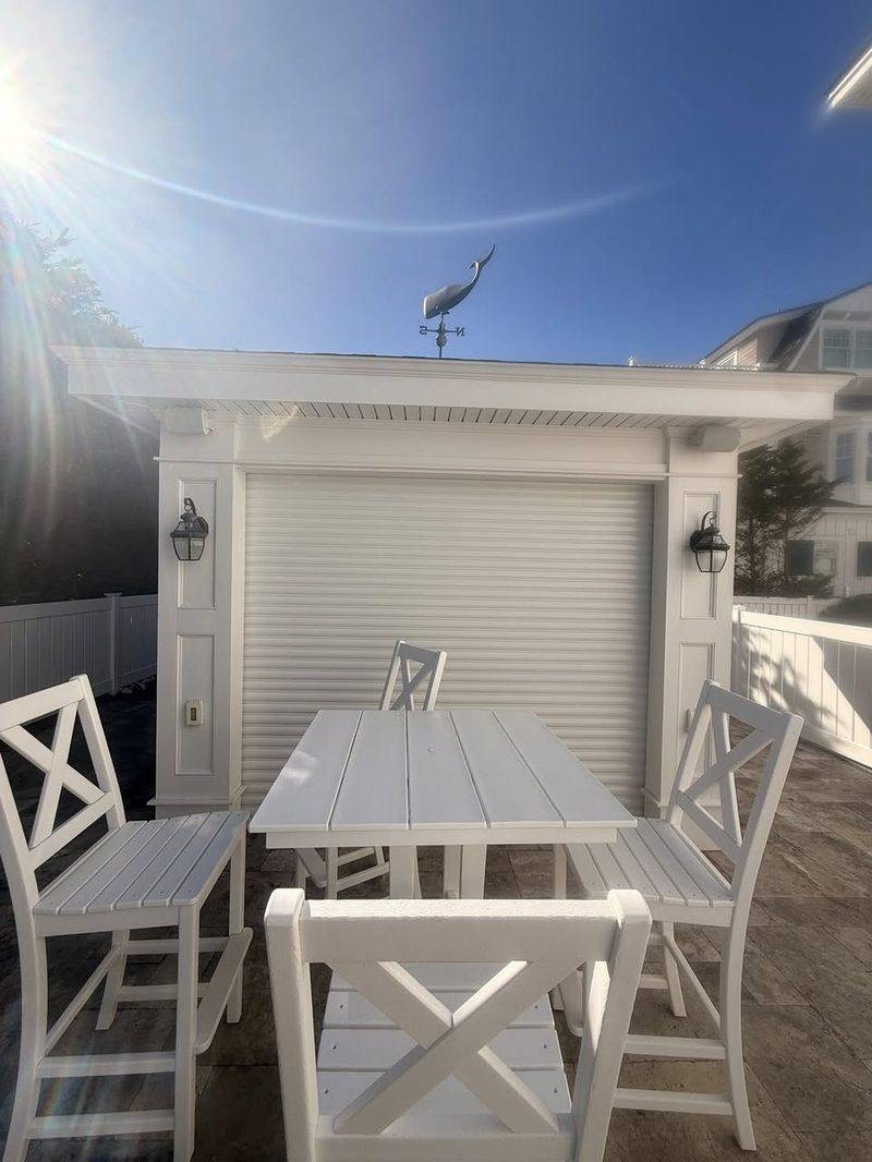 Refreshed outdoor cabana with new furniture and clean trim