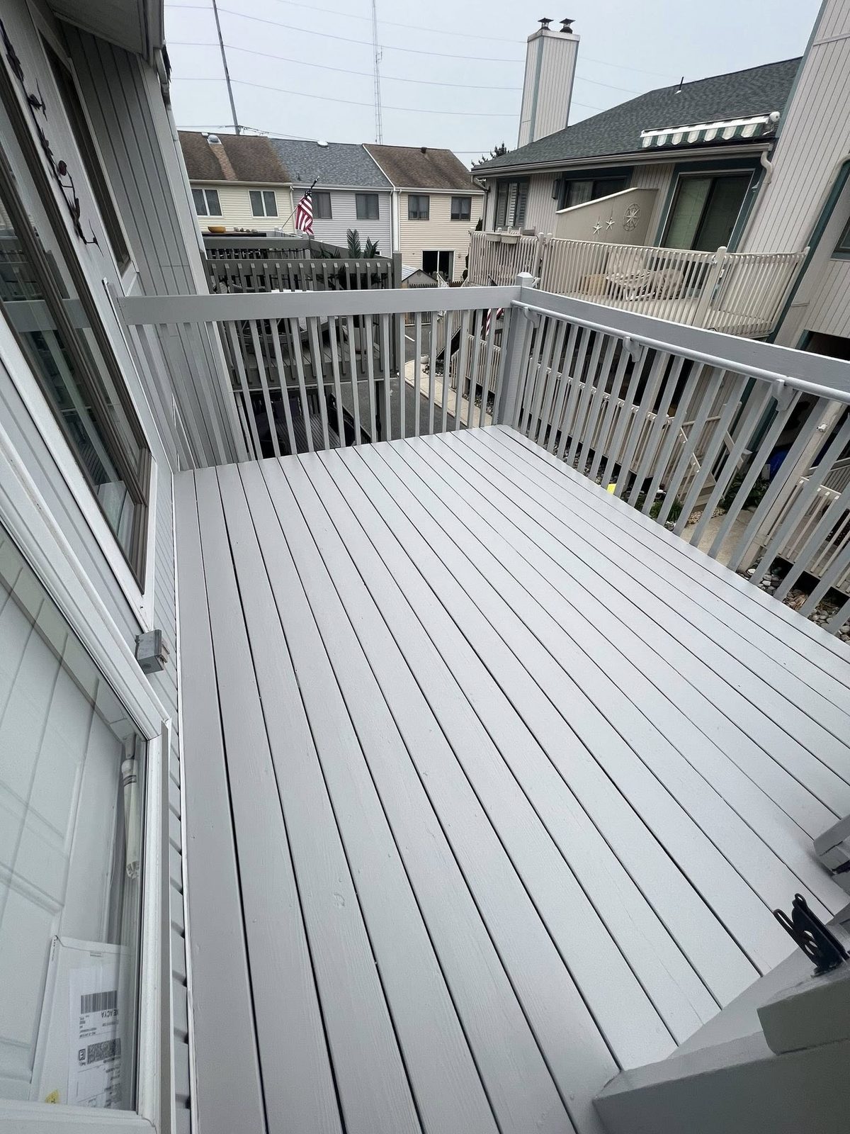 Deck floor refinished after power wash and repaint