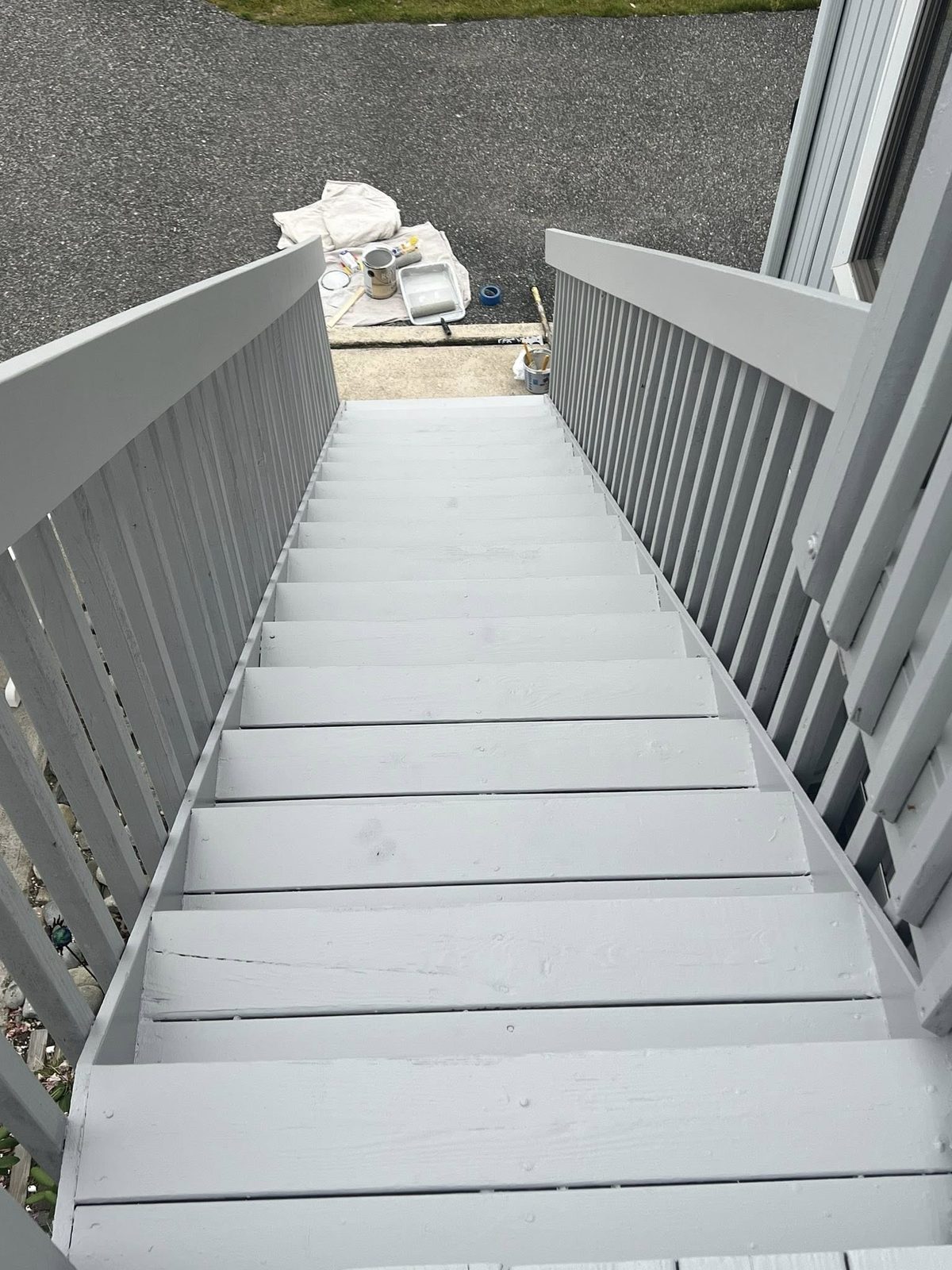 Exterior deck stairs repainted after prep and primer, clean finish