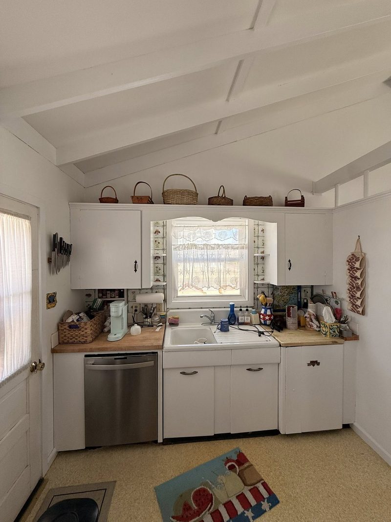 Completed sunroom rebuild with new window detail and fresh paint