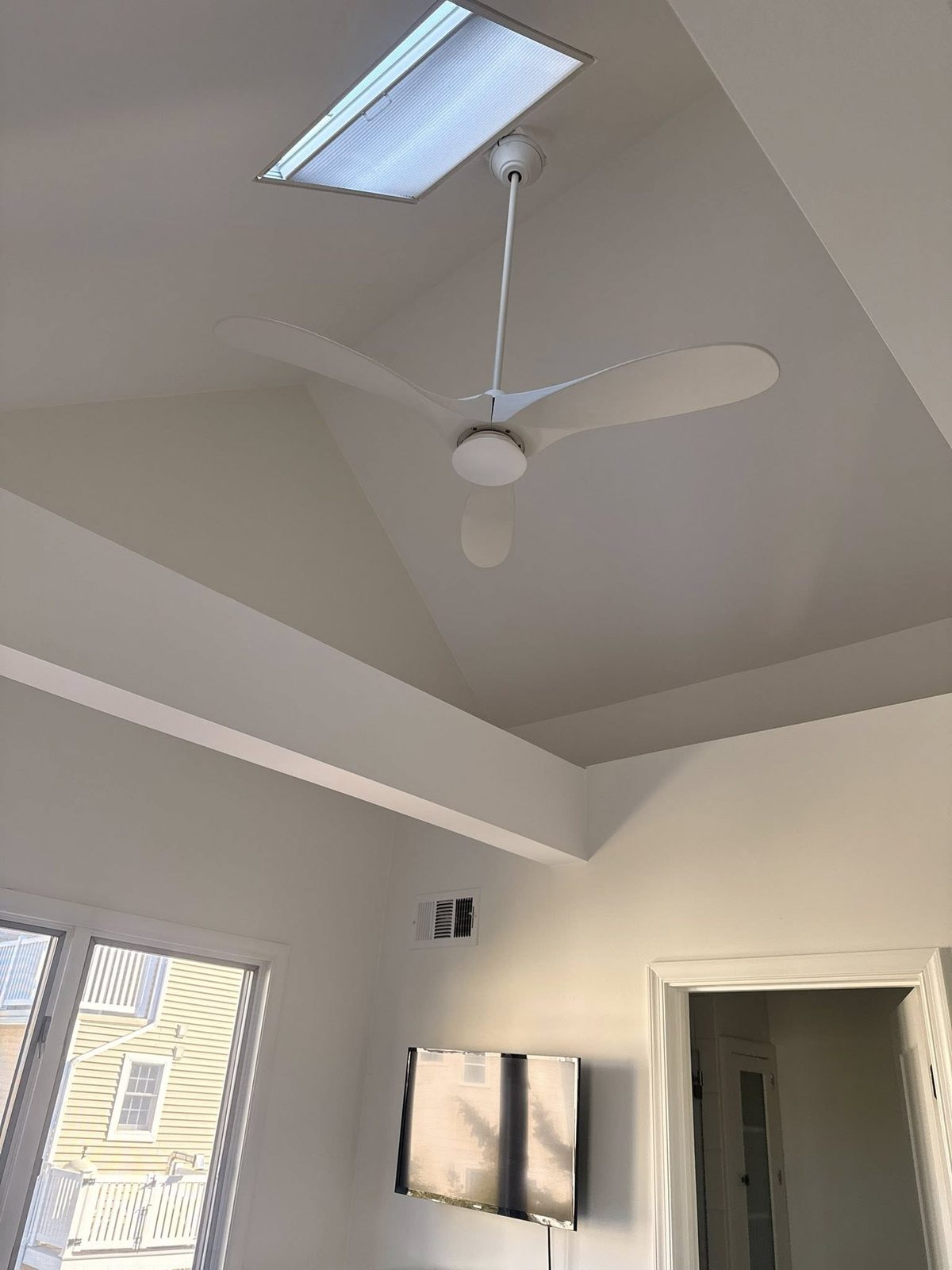 Thirteen-door whole-home interior build, vaulted hallway view