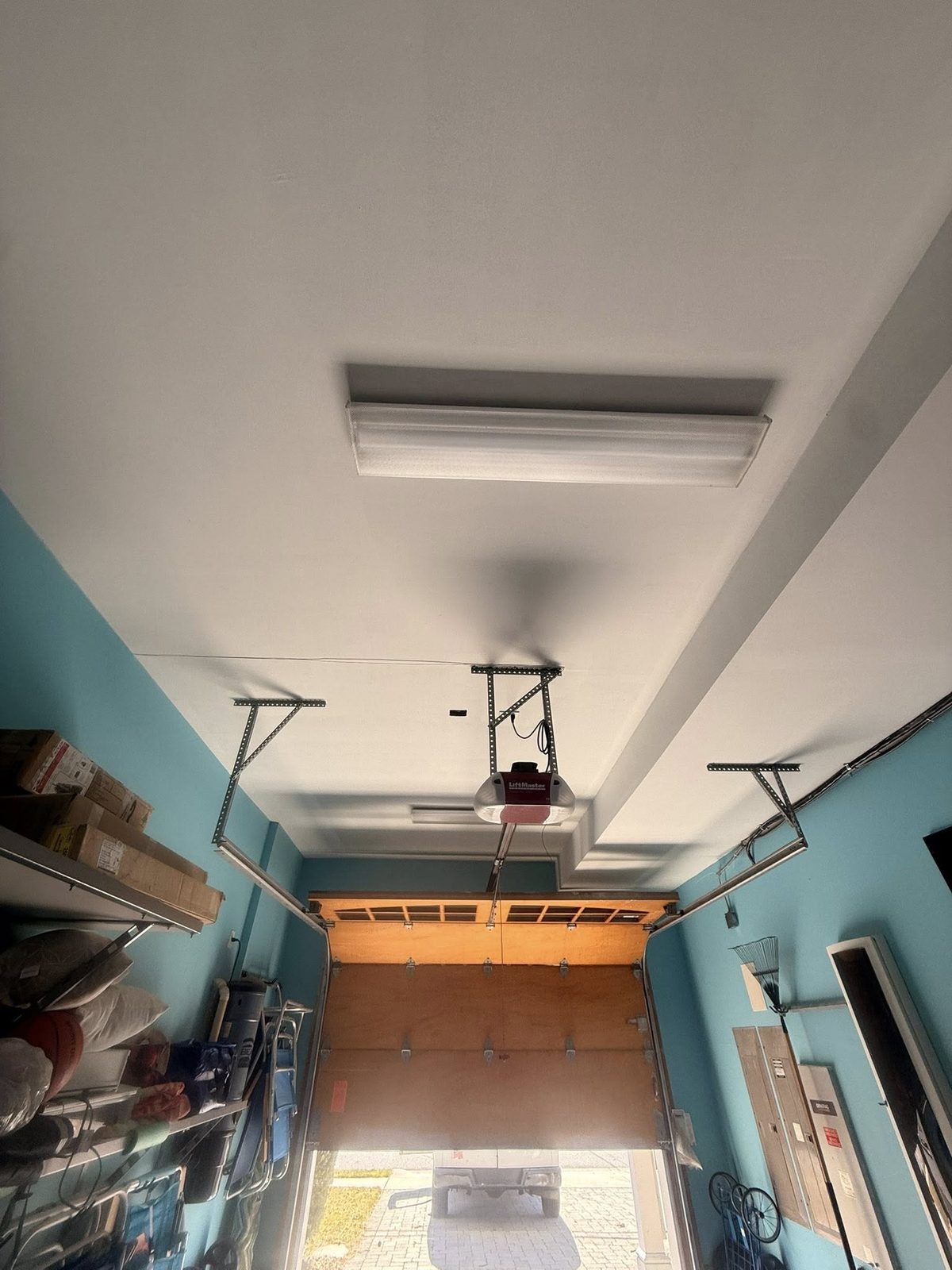 Garage interior refreshed in Repose Blue with bright white trim