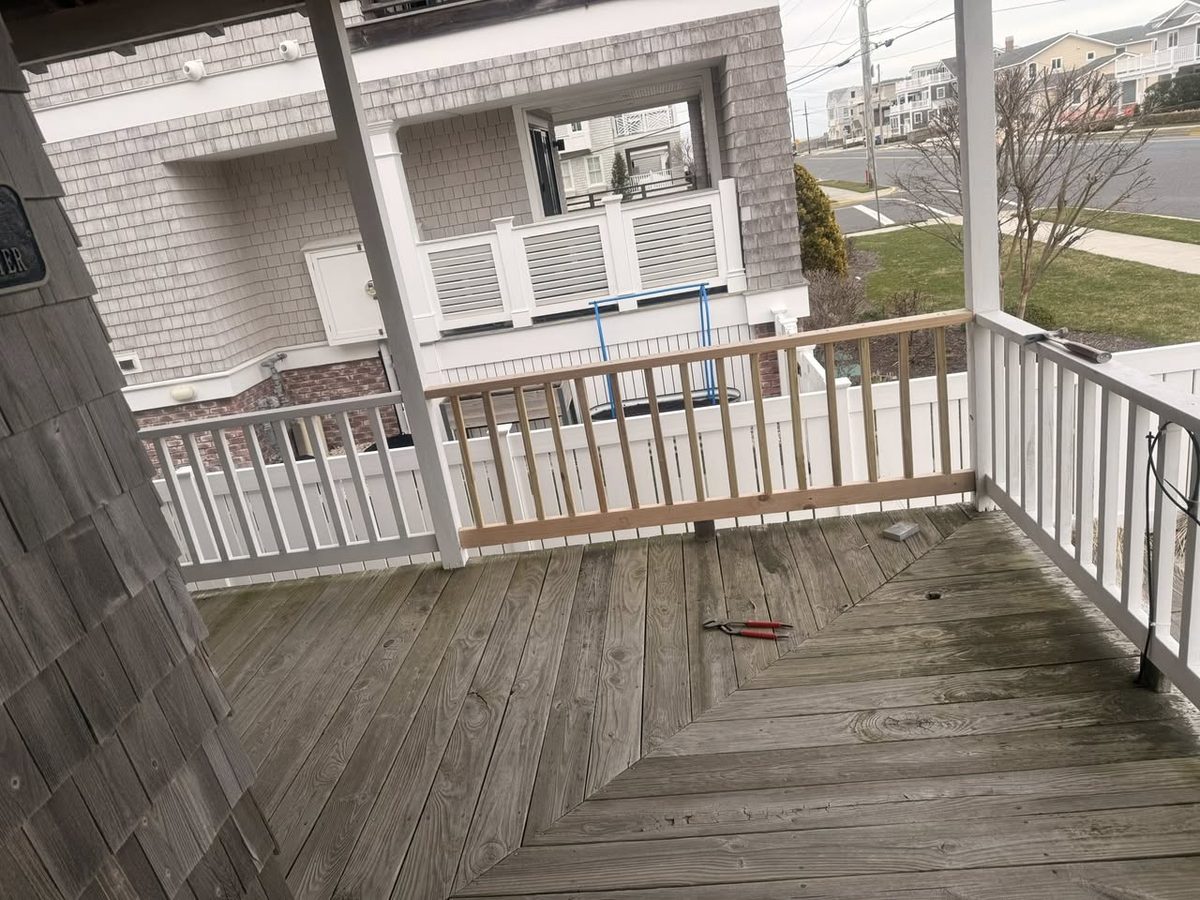 Before: porch with rotted railing